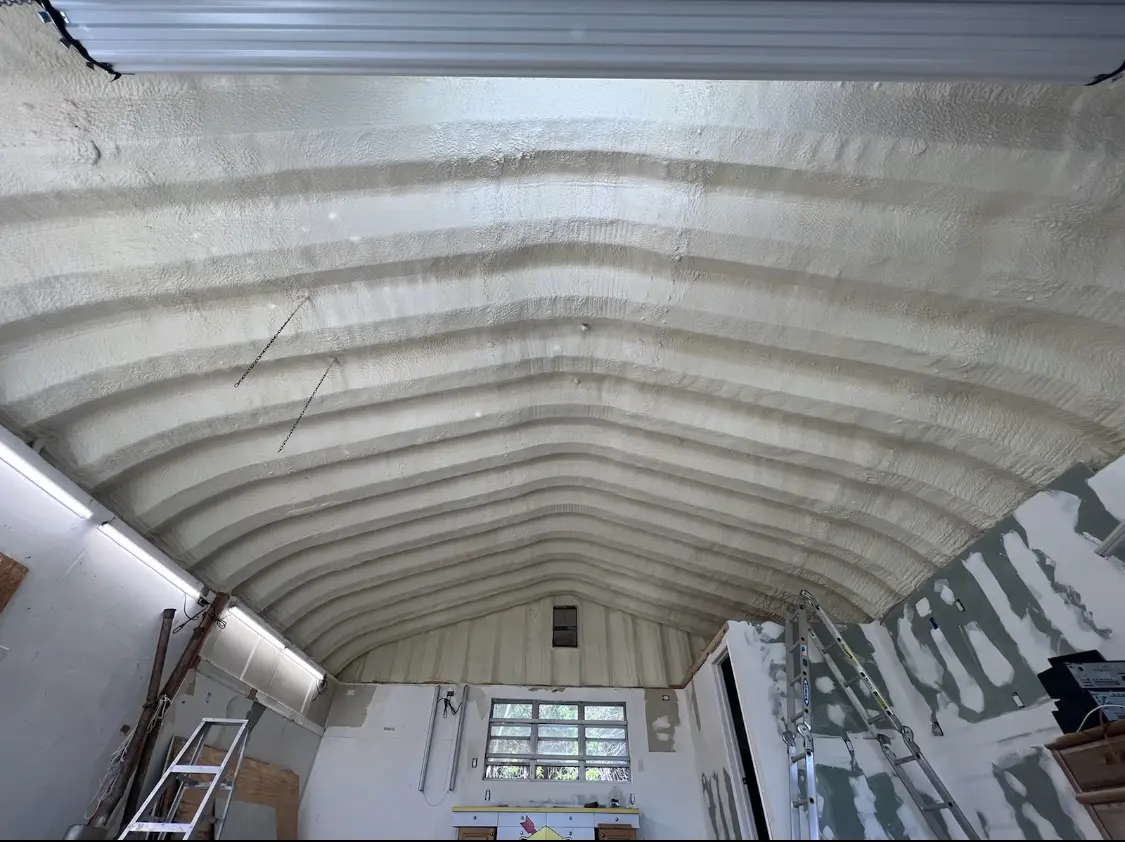 Spray polyurethane foam applied to the underside of a metal roof deck in Highland Heights